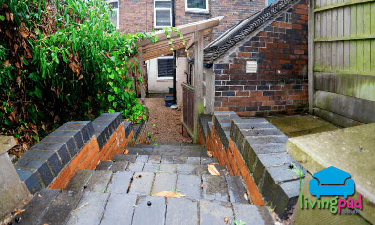 Steps down from raised garden patio